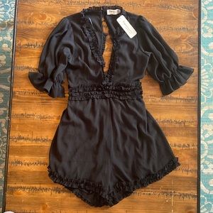 NWT Black flirty Romper, size Medium